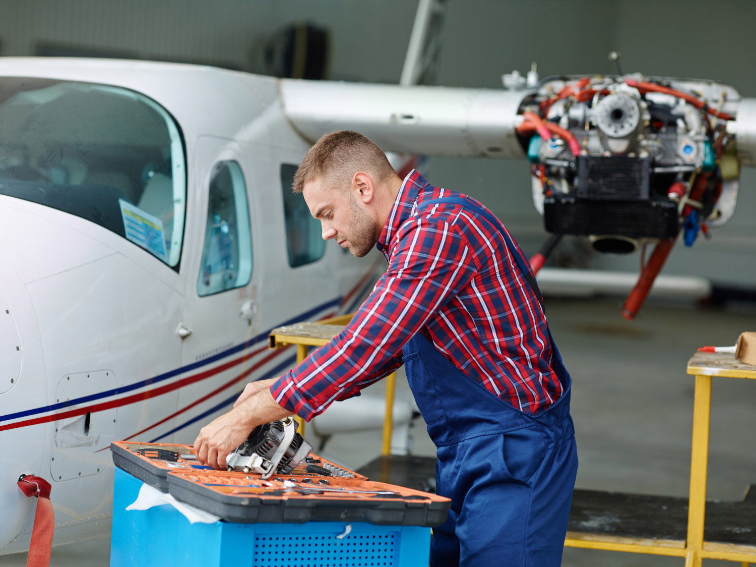 Aircraft engineer working with an airplane.