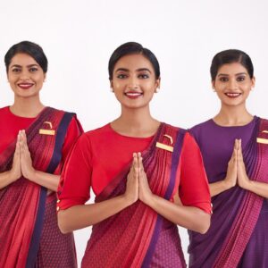 Air India female Cabin Crew namaste in new uniform.