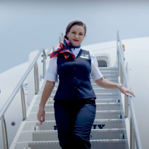 AeroMexico female Flight Attendants walking down the stairs.