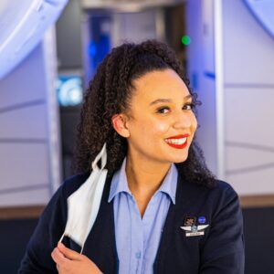 Alaska Airlines female Flight Attendant in the cabin.