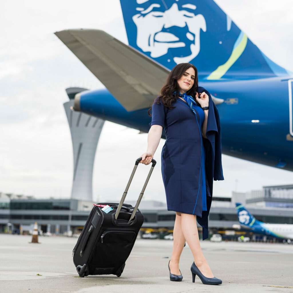 Alaska Airlines female Flight Attendants with trolley.