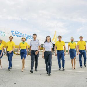 Cebu Pacific Cabin Crew and Pilots walking on tarmac.