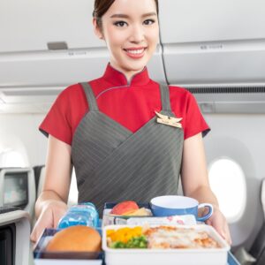 China Airlines air hostess serving food.