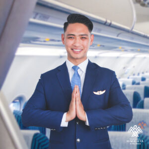 Himalaya Airlines male Cabin Crew inside the plane.