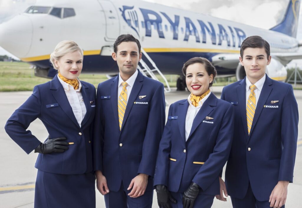 Ryanair female and male cabin crew on tarmac.