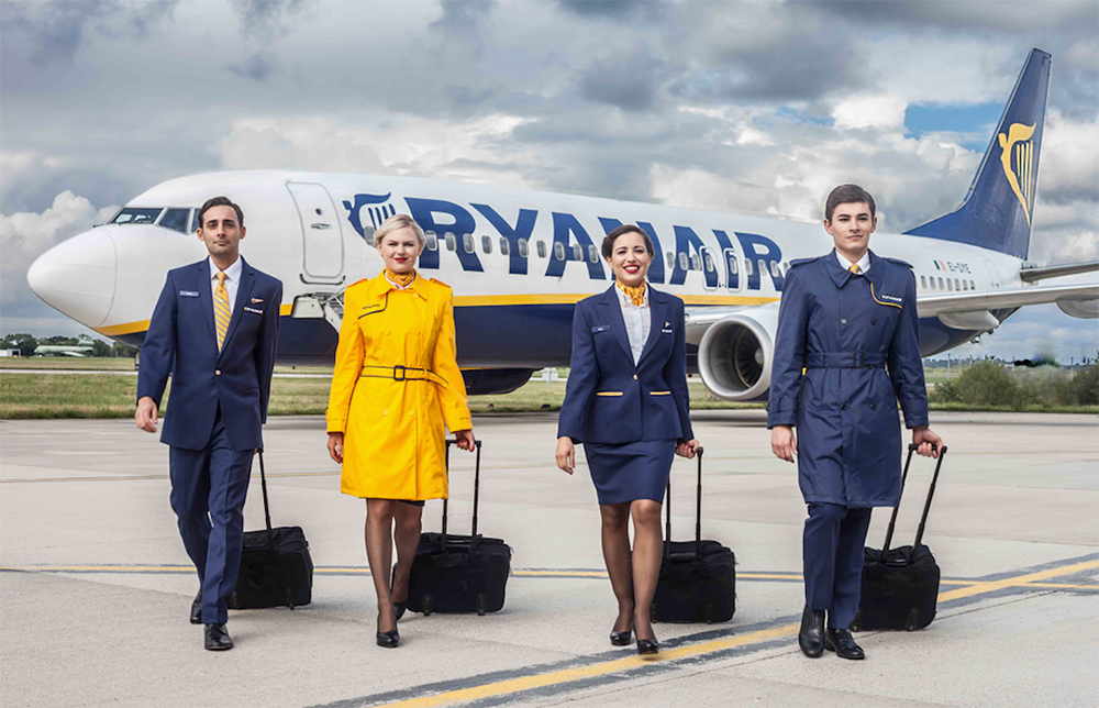 Ryanair male and female cabin crew on tarmac.