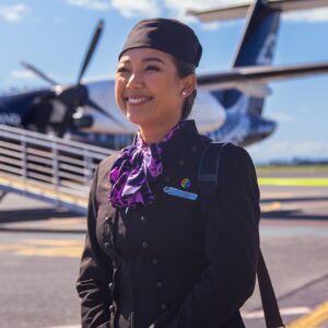 Air New Zealand female Flight Attendant on tarmac.
